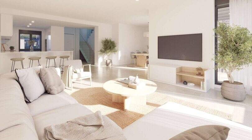 Helles Wohnzimmer eines Neubau-Chalets in Palma mit offener Küche, modernem TV-Bereich und Naturmaterialien.