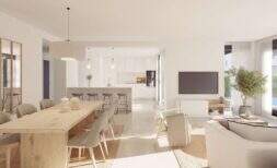 Bright living-dining room with open kitchen, wooden table and pool view in new build chalet Palma