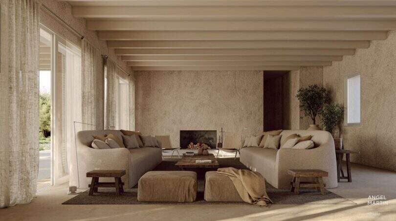 Helles Wohnzimmer der Designer-Villa Santanyí mit Natursteinwänden, Holzbalken und eleganter Sitzlandschaft in Erdtönen.