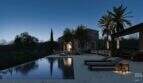Abendstimmung: Infinity-Pool mit Liegestühlen und beleuchteter Steinfassade der Designer-Villa in Santanyí