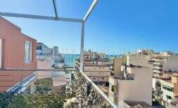 Rooftop terrace of the penthouse with pergola and sea view over the roofs of Playa de Palma