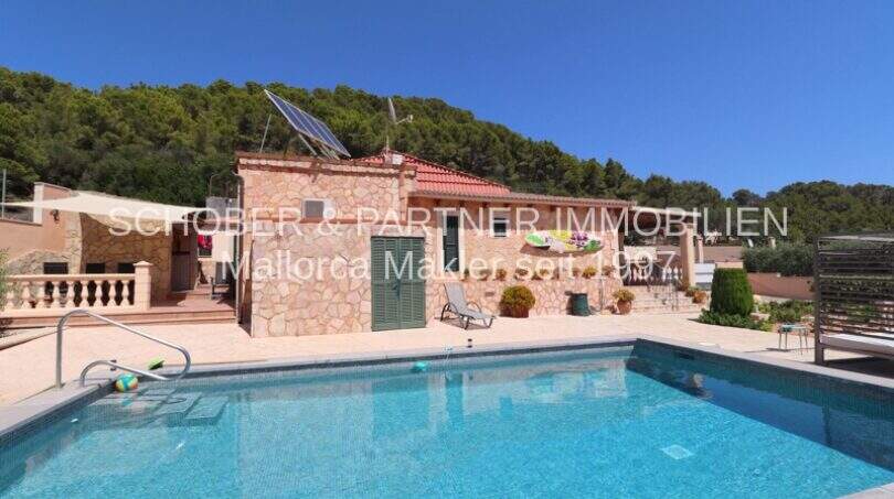 Finca Son Servera: Large pool with terrace, natural stone house and solar panels, surrounded by pine forest