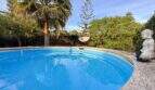 Runder Pool mit Palme, Hängesessel und Buddha-Statue im mediterranen Garten der Wohlfühloase in Cala Murada