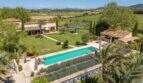 Aerial view of the Felanitx finca with large pool, lavender beds, palm trees and view of the vineyards