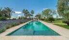 Infinity pool with lavender beds and palms of the exclusive Finca in Felanitx