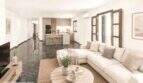 Helles Wohnzimmer mit cremefarbenem Sofa, dunklem Marmorboden und offener Küche in Felanitx