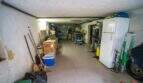 Geräumige Garage mit Werkstattbereich, Kühlschrank und Stauraum im Einfamilienhaus Porto Colom