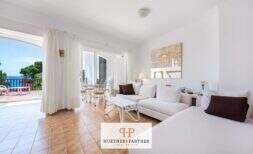 Ground floor apartment in Cala Mandía with terrace and garden on the first sea line