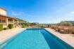 Spacious outdoor pool with panoramic views of Son Servera, Mediterranean finca with terrace and lounge furniture