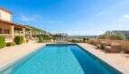 Spacious outdoor pool with panoramic views of Son Servera, Mediterranean finca with terrace and lounge furniture