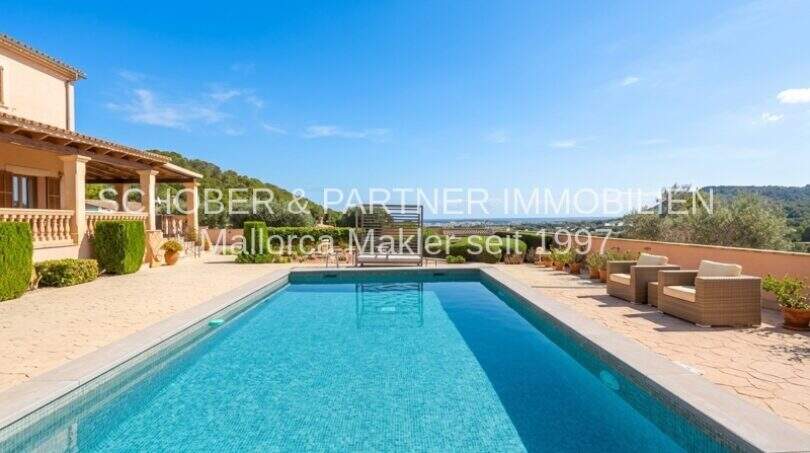 Spacious outdoor pool with panoramic views of Son Servera, Mediterranean finca with terrace and lounge furniture