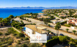 Aerial view of a Mediterranean villa in Sa Torre with pool, palm garden and spectacular sea view in Llucmajor