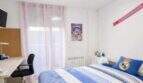 Bright children's room with Real Madrid bedding, desk and balcony access in ground floor apartment Palma.