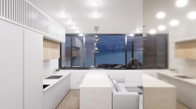 Modernes weißes Penthouse-Loft in Palma mit offener Küche, Wohnbereich und Panoramafenster mit Meerblick