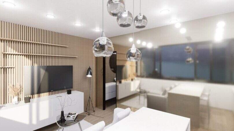 Modernes Wohnzimmer im Penthouse-Loft Palma mit Holzlamellenw and, TV-Bereich und eleganten Pendelleuchten