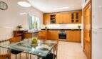 Modern kitchen with high-quality equipment and optimal work surface arrangement