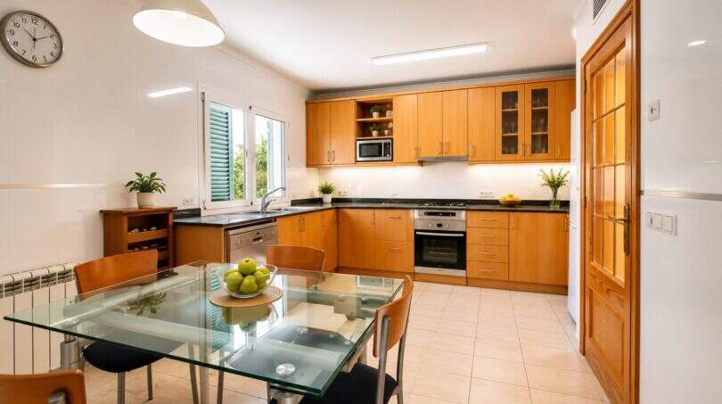 Modern kitchen with high-quality equipment and optimal work surface arrangement