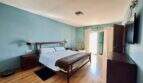 Comfortable master bedroom with direct terrace access and high-quality furnishings