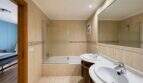 Luxurious bathroom with double vanity, walk-in shower and large mirror