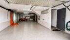 Functional garage with comprehensive storage solution and practical ancillary rooms