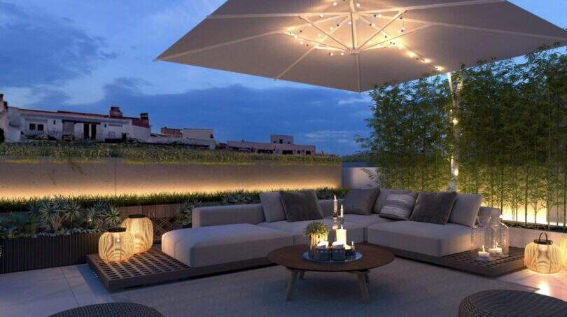 Elegant Roof Terrace with Lounge Furniture, Sunshade, and Atmospheric Lighting in New Development Project Palma