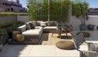 Spacious Roof Terrace with Lounge Furniture, Bamboo Privacy Screen, and City View in Palma de Mallorca