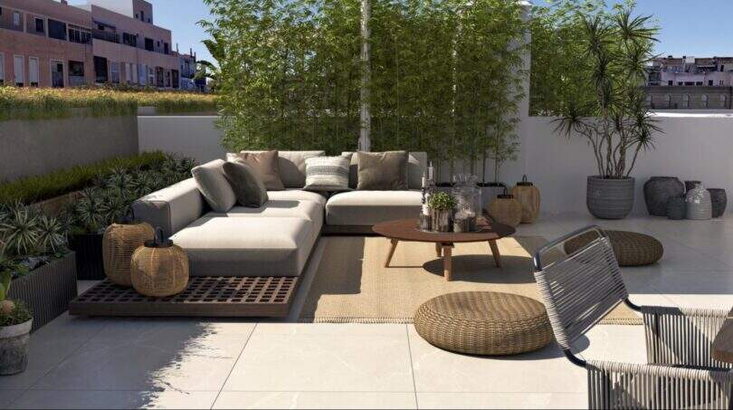 Spacious Roof Terrace with Lounge Furniture, Bamboo Privacy Screen, and City View in Palma de Mallorca