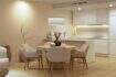 Bright living-dining room with wooden table, modern kitchen and warm design in new building Palma de Mallorca