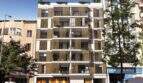 Modern New Building in Palma with Wood Slat Facade, Balconies, and Green Plants in Urban Downtown Location