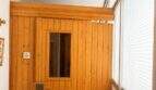 Sauna aus Holz mit Glastür in der exklusiven Wohnung am Paseo Marítimo, Palma de Mallorca