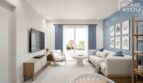 Sala de estar luminosa con pared de acento azul, sofá, TV y balcón con vistas a la piscina en el apartamento Portocolom