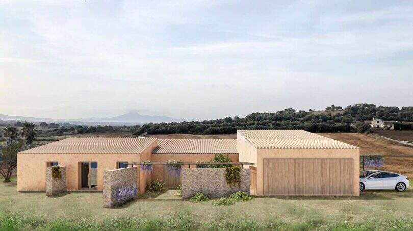 Außenansicht Neubaufinca Petra: Mediterranes Landhaus mit Natursteinmauern, Terrakottadach und Garage in ruhiger Panoramalage.