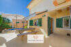 Sunny terrace with picnic table, umbrella and pool of a charming house in Cala Murada.