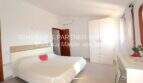 Bright bedroom of the Mallorca finca with double bed, wardrobe and air conditioning in Son Carrió.
