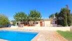 Exterior view Finca Son Carrió: Pool, terrace with sun loungers, Mediterranean garden and single-story country house.