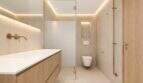 Modernes Designer-Badezimmer mit Goldakzenten, schwebenden Holzmöbeln und indirekter LED-Beleuchtung im Duplex Palma