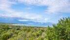 Panoramic view from the finca of the bay, sea and mountains in Colònia de Sant Pere with lush Mediterranean vegetation