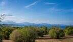 Extensive property with Mediterranean scrubland and panoramic view of the turquoise sea and mountain range
