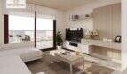 Helles Wohnzimmer der Neubauwohnung in Cala Ratjada mit modernem TV-Möbel, Sofa und Zugang zum Balkon.