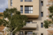 Moderno apartamento de nueva construcción en Palma de Mallorca, fachada de arenisca clara, balcones, ubicación céntrica en la ciudad.