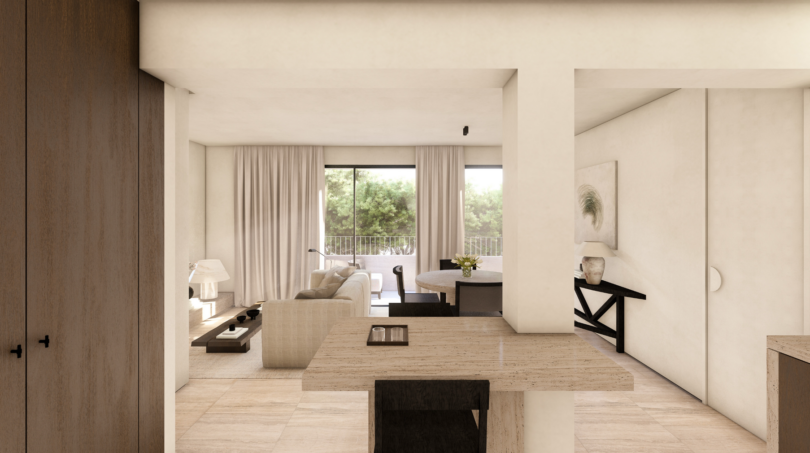 Sala luminosa con piso de mármol, tonos neutros y balcón con vistas al jardín en Palma de Mallorca
