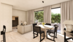 Sala luminosa con mesa de comedor, sillas negras y balcón con vistas al jardín en Palma de Mallorca