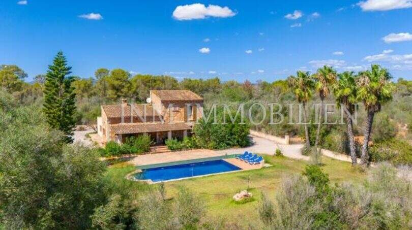 Aerial view of the finca near Campos with large pool, palms and Mediterranean garden