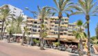Promenade with palm trees in front of modern apartment building in first sea line, Palma de Mallorca