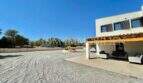Extensive gravel driveway of a modern finca in Campos with covered terrace and solar system.