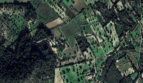 Luftaufnahme eines markierten Baugrundstücks in grüner Landschaft bei Felanitx, Mallorca.