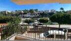 Balkon der Hafenwohnung Porto Cristo mit Blick auf Marina, Boote und Felsenküste