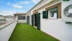 Roof terrace with artificial turf area, green shutters and air conditioning in Felanitx