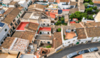 Aerial view of historic old town houses in Felanitx with terracotta roofs, terraces and courtyards