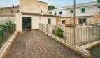 Roof terrace with metal railing and view of neighboring buildings, Felanitx townhouse